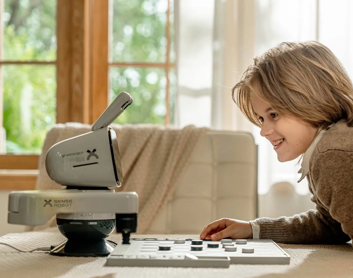 Family member playing chess with SenseRobot Chess Lite
